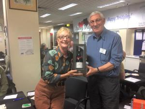 1st door prize winners: a bottle of aged port, donated by Allen Rosenberg on behalf of the Stroke Recovery Association.